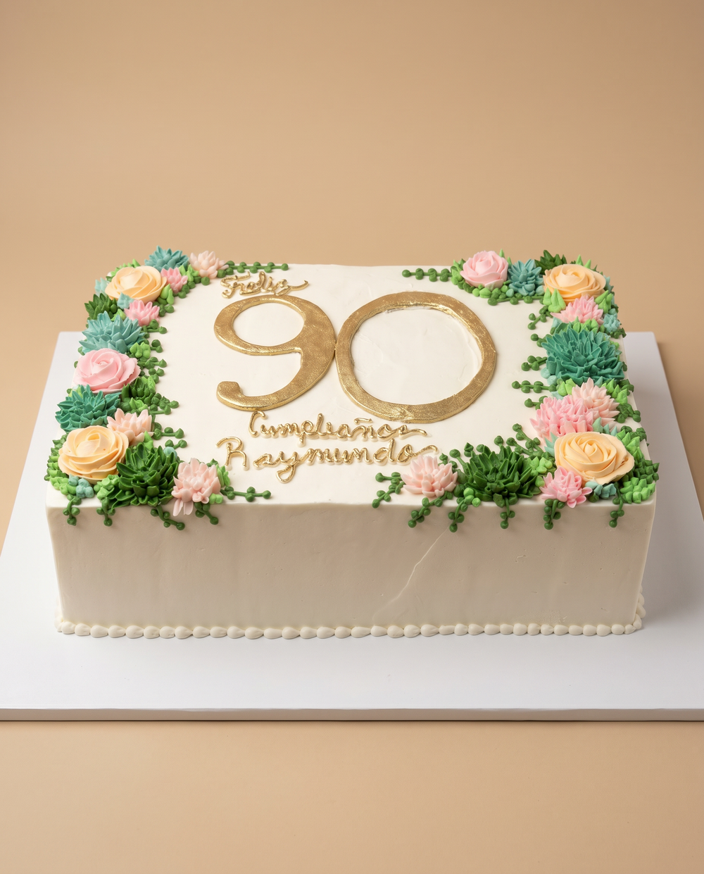 White square 90th birthday sheet cake with gold lettering and buttercream succulents and roses