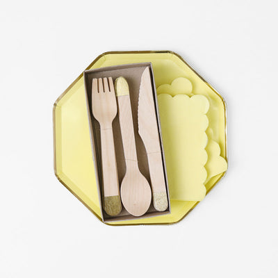 party kit with wooden cutlery, side plates, and napkins